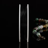 12 Pack: Beadalon® 0.015" Black 7 Strand Bead Stringing Wire, 60ft.