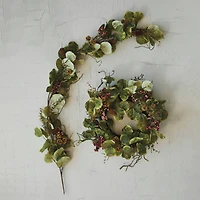Hello Honey® 24" Green & Red Faux Zanzibar Leaf Wreath with Berries