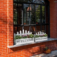 Glitzhome® White Wood WELCOME Fence-Inspired Planter Stand Set