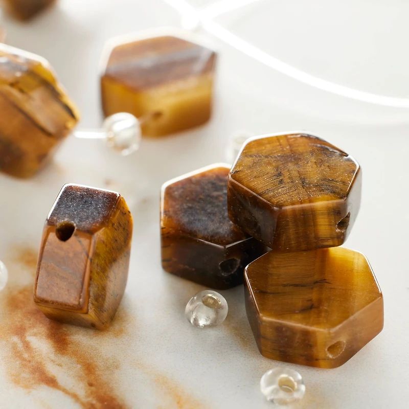 12 Packs: 8 ct. (96 total) Brown Tiger's Eye Hexagon Beads, 12mm by Bead Landing™