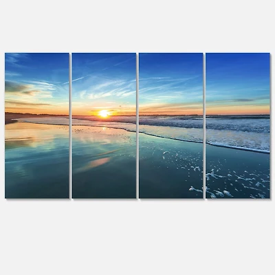 Designart - Blue Seashore with Distant Sunset