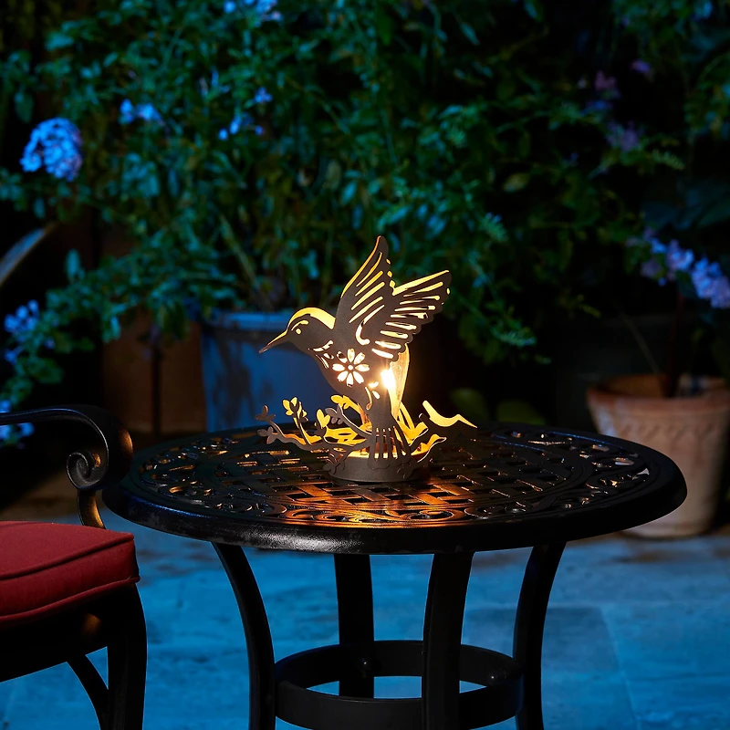 Glitzhome® 9.75" Metal Flying Hummingbird Silhouette Solar Powered Edison Bulb Outdoor Lanterns, 2ct.