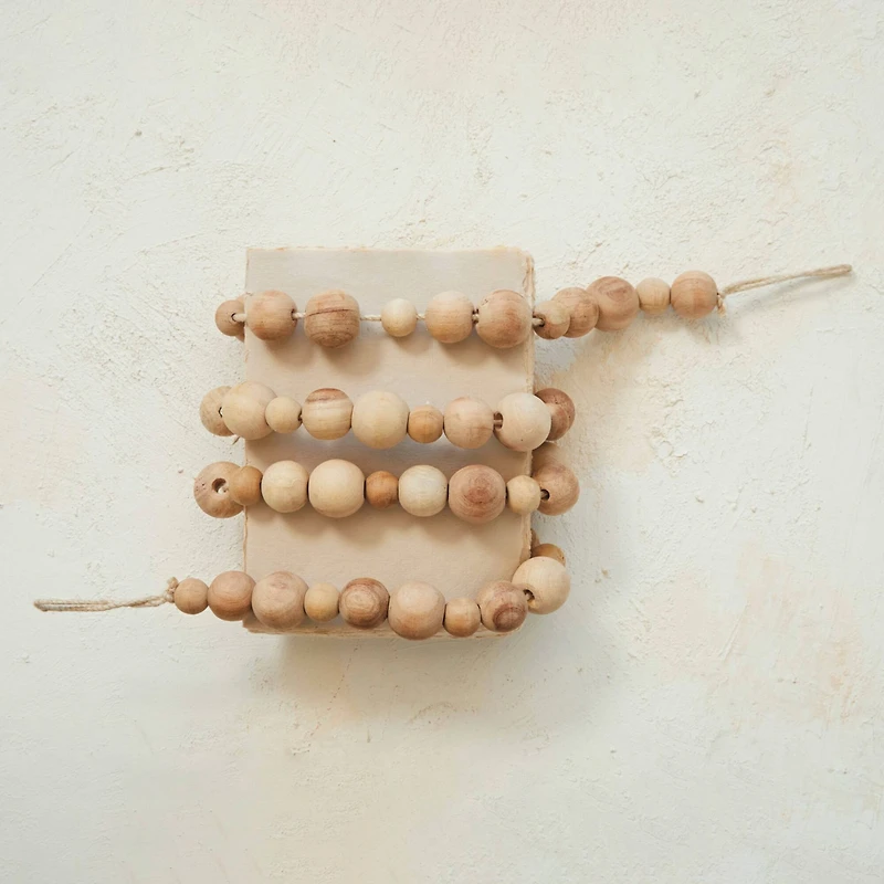 Hello Honey® 6ft. Natural Mango Wood Bead Garland
