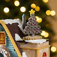 Glitzhome® 10.25" Lighted Christmas Donuts & Coffee Shop Resin Village with Movement and Music