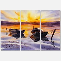 Designart - Sunset and Two Small Boats Parking On The Shore