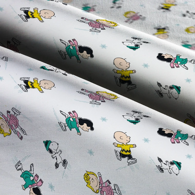 Peanuts® Gang Ice Skating Cotton Fabric