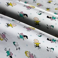 Peanuts® Gang Ice Skating Cotton Fabric