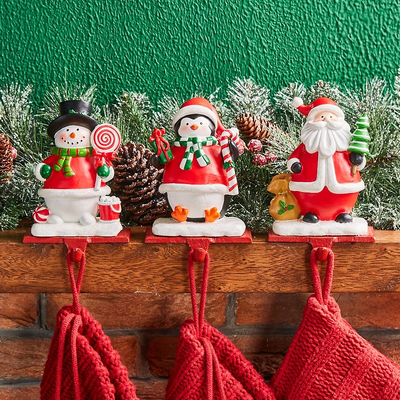Glitzhome® 7" Santa, Snowman & Penguin Stocking Holder Set