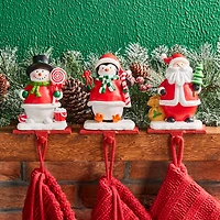 Glitzhome® 7" Santa, Snowman & Penguin Stocking Holder Set