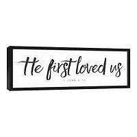 He First Loved Us 37.73" x 13.73" Black Framed Canvas