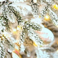 7ft. Pre-Lit Deluxe Flocked Pine Artificial Christmas Tree, Warm White LED Lights