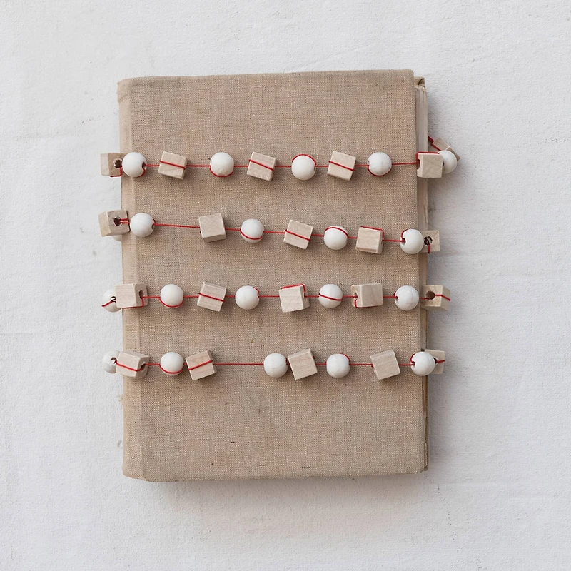 Hello Honey® 6ft. Paulownia Wood Mixed Shapes Beads & Red String Garland