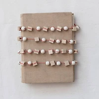 Hello Honey® 6ft. Paulownia Wood Mixed Shapes Beads & Red String Garland