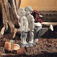 Design Toscano® 22" Young Sweethearts Kissing Children Garden Statue
