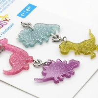 12 Packs: 4 ct. (48 total) Glittery Dinosaur Charms by Creatology™