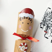 Glitzhome® 8PK 2"D x 12"H Gingerbread Man Christmas Party Crackers with Gift Contents