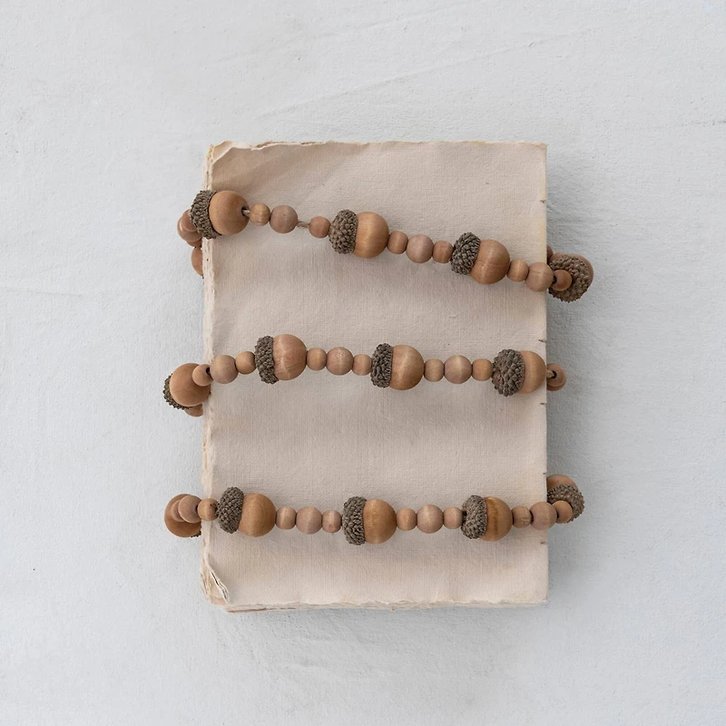 Hello Honey® 6ft. Brown Paulownia Wood Acorns & Beads Garland