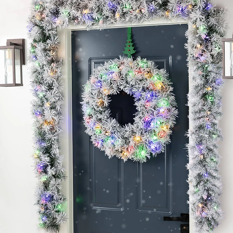 Glitzhome® 6ft Pre-Lit Snow Flocked Greenery Pine Christmas Garland with Timer, 2ct.