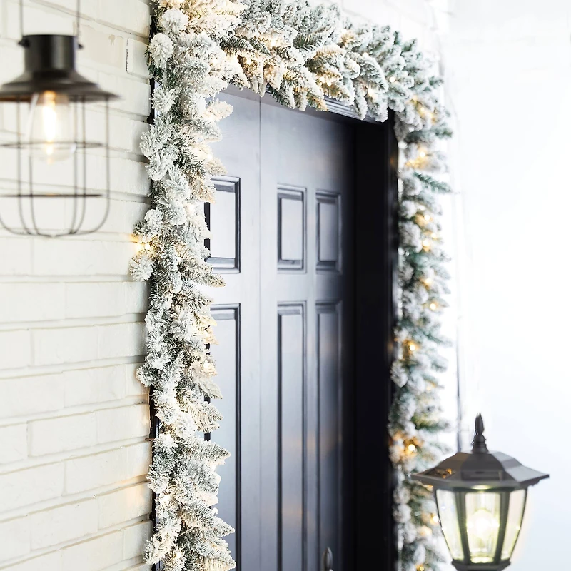 Glitzhome® 9ft. LED Snow Flocked Christmas Garlands with Timer, 2ct.