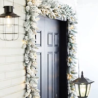 Glitzhome® 9ft. LED Snow Flocked Christmas Garlands with Timer, 2ct.
