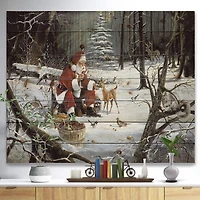 Designart - Santa Claus with deer in snowy woods