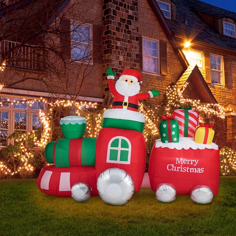 Glitzhome® 8ft. Lighted Inflatable Santa On Pick-Up Train Décor
