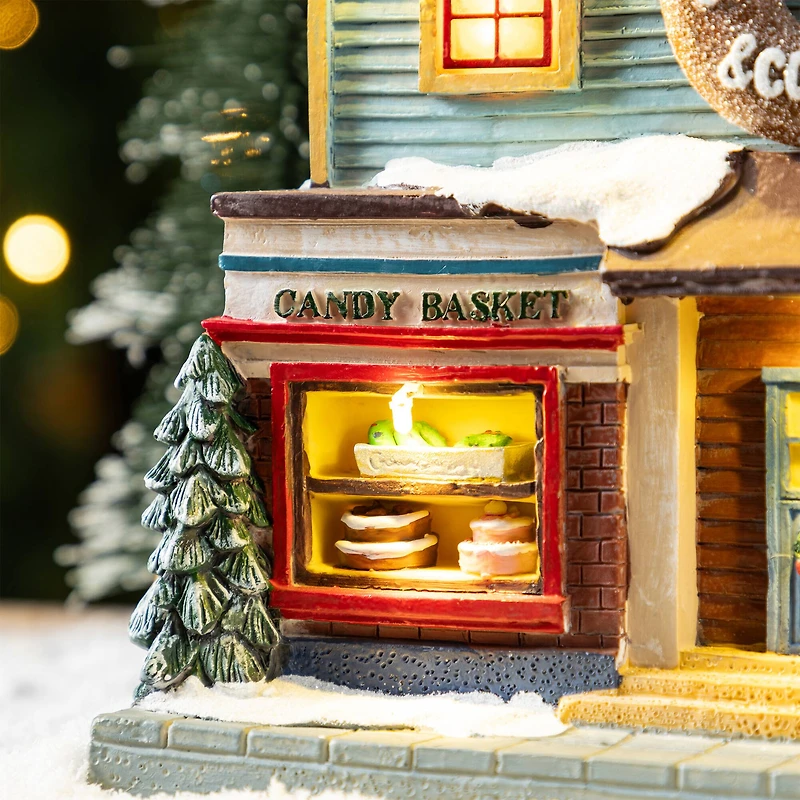 Glitzhome® 10.25" Lighted Christmas Donuts & Coffee Shop Resin Village with Movement and Music