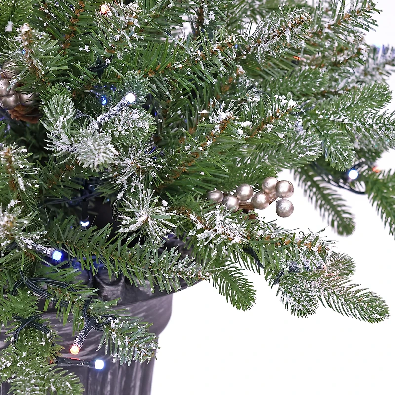 24" Feel Real® Snowy Morgan Spruce Porch Bush in Silver Brushed Plastic Urn with Cones & Champagne Berries
