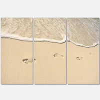Designart - Footprints in Sand on the Beach