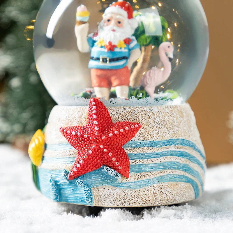 Glitzhome® 100mm Christmas Resin Musical Snowflakes Santa on Vacation Waterglobe