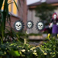 Glitzhome® 24" Halloween Metal Sunflower Skulls Glow-in-Dark Yard Stakes, 3ct.