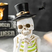 Glitzhome® 10" Lighted Halloween Resin Skull Reading Book Table Décor