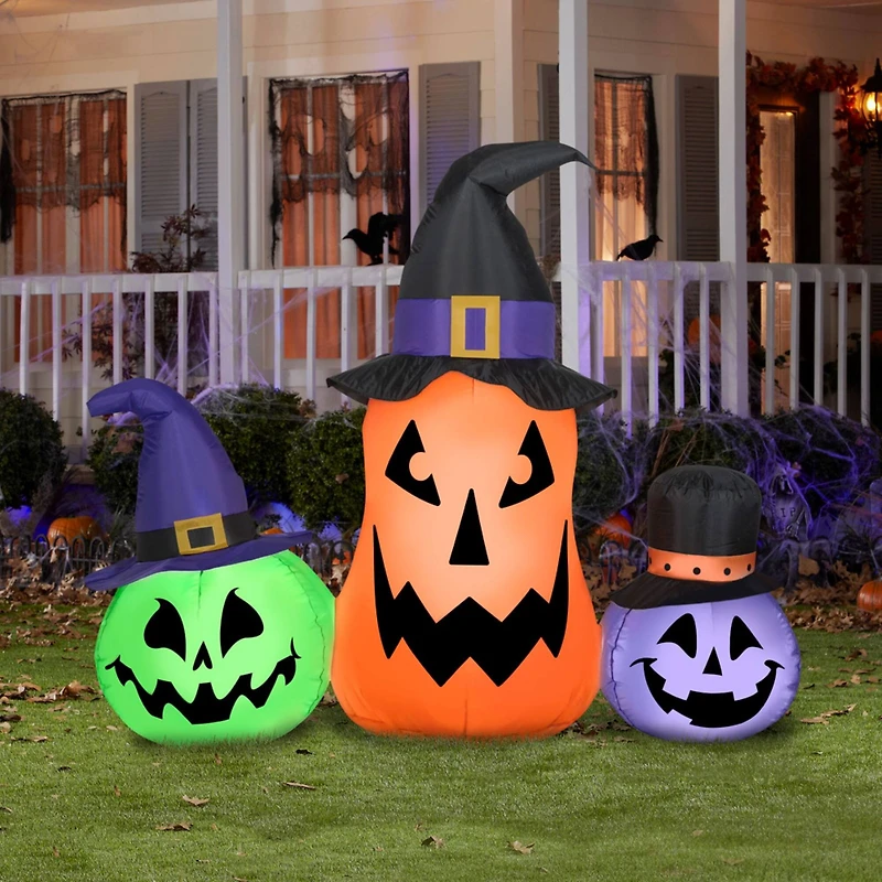 4.5ft. Airblown® Inflatable Halloween Whimsical Pumpkin Trio with Hats Scene