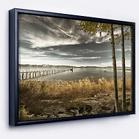 Designart - Pier in Brown Lake