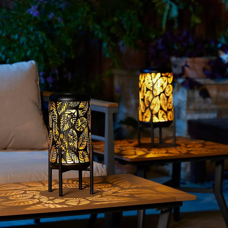 Glitzhome® 14.25" Black Metal Cutout Leaves Pattern Solar Powered LED Outdoor Lantern, 2ct.