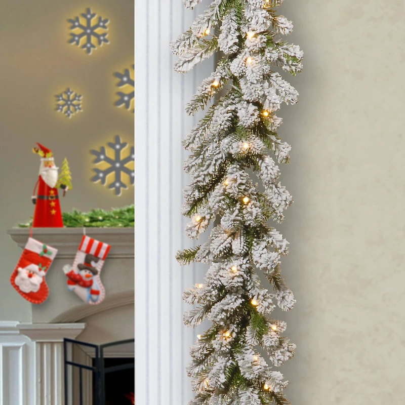 9ft. Pre-lit Feel Real® Snowy Sheffield Spruce Artificial Christmas Garland with 70 Clear Lights