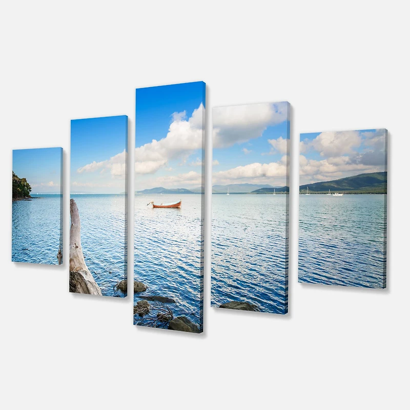 Designart - Small Wooden Boat and Tree Trunk