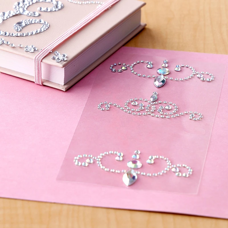 12 Packs: 4 ct. (48 total) Curved Flourish Adhesive Rhinestones by Recollections™