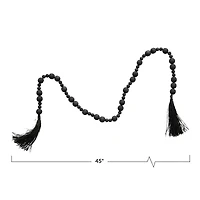 Hello Honey® 45" Black Acacia Wood Bead Garland with Raffia Tassel