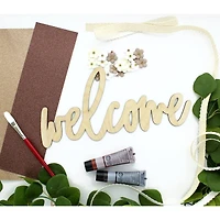 Leisure Arts® 12" Wood Welcome Word
