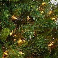 4.5ft. Pre-Lit Wyoming Mixed Pine Artificial Christmas Tree in White Tower Planter, Clear Lights