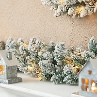 Glitzhome® 6ft. Pre-Lit Snow Flocked Christmas Garland, 2ct.
