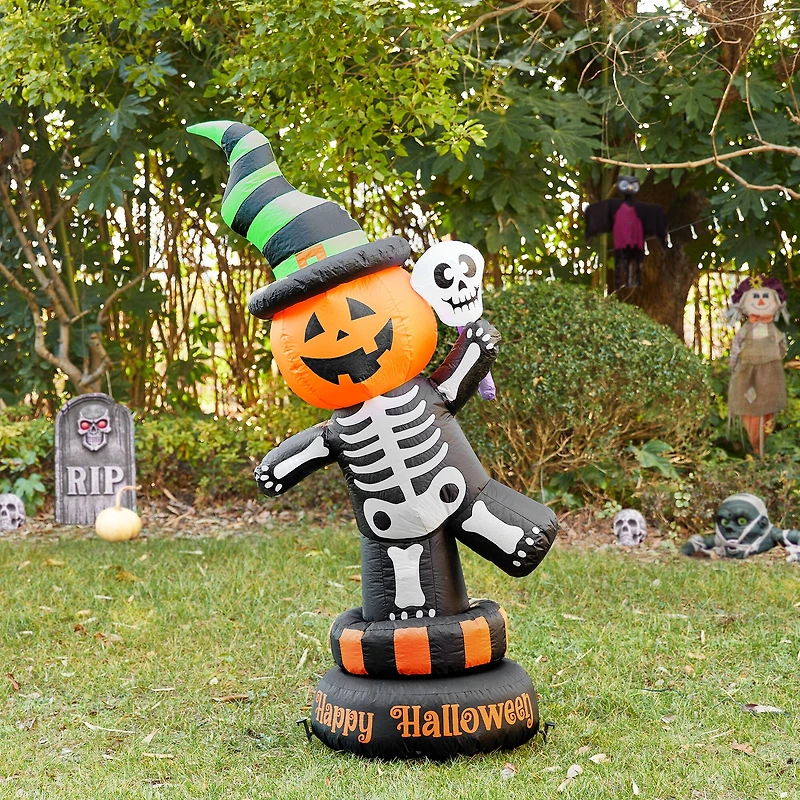 Glitzhome® 6ft. Lighted Halloween Jack-O'-Lantern Skeleton Rotating Inflatable Décor