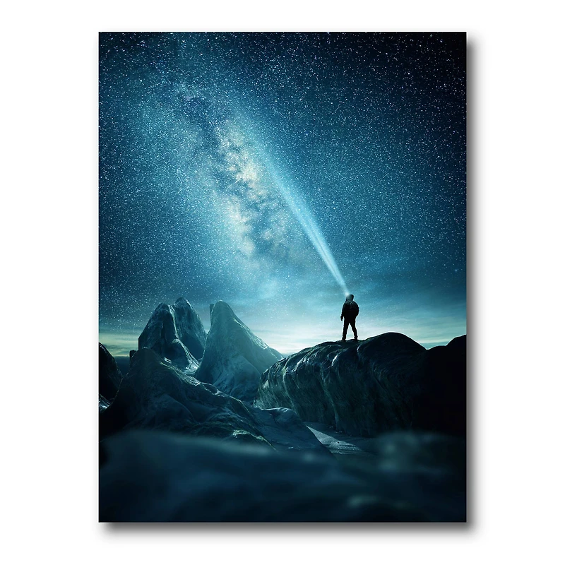 Designart - A Man Shining A Light Into The Night Sky