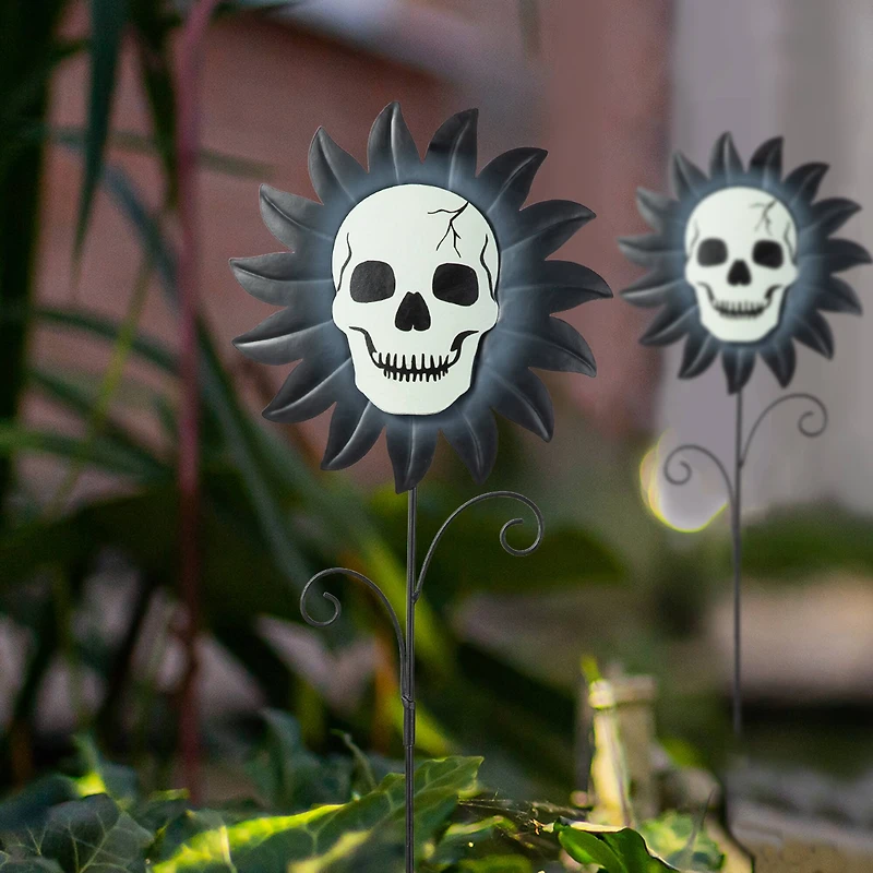 Glitzhome® 24" Halloween Metal Sunflower Skulls Glow-in-Dark Yard Stakes, 3ct.