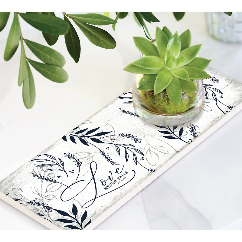 6" x 15.75" Love Never Fails Wood Plaque