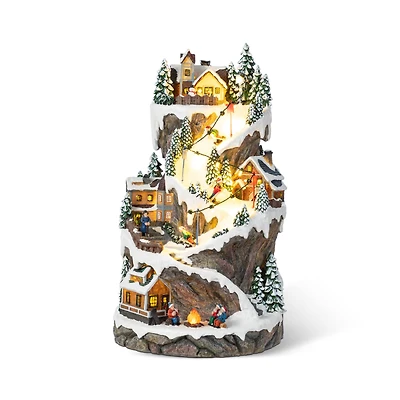 Glitzhome® 15.5" Lighted Christmas Skiing Moutain Resin Village with Movement and Music