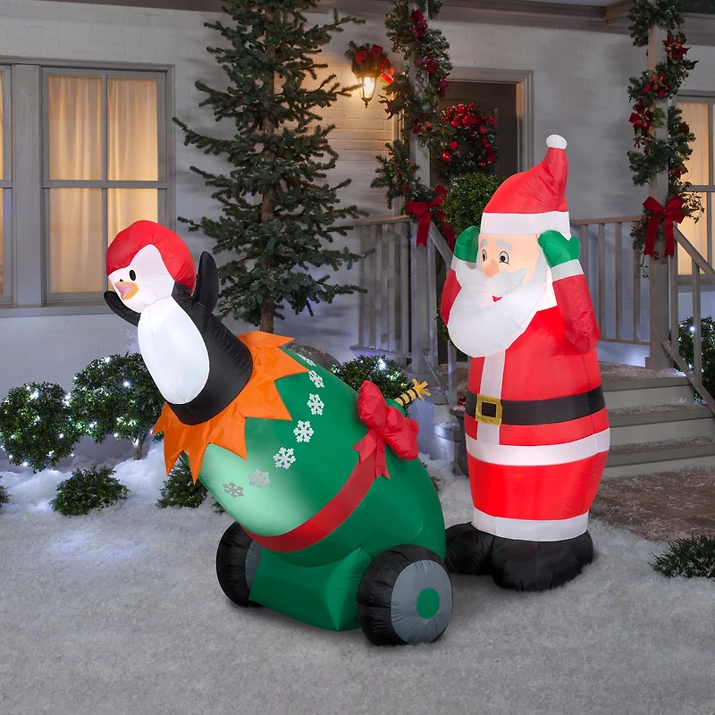 5.5ft. Lightshow Airblown® Inflatable Christmas Santa & Penguin Cannon Scene with Sparkle