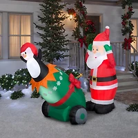 5.5ft. Lightshow Airblown® Inflatable Christmas Santa & Penguin Cannon Scene with Sparkle