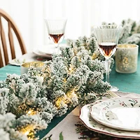 Glitzhome® 6ft. Pre-Lit Snow Flocked Christmas Garland, 2ct.